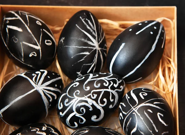 stock image Creative trendy painted easter eggs on black background. Easter ideas. Background with easter eggs.