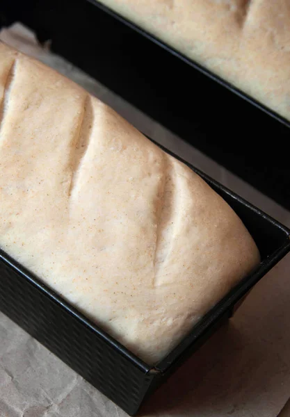 Bread dough before baking in a baking pan.