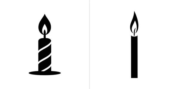 This black and white image shows two candles, both with lit flames. The candle on the left is striped and has a thick base, while the other is straight.