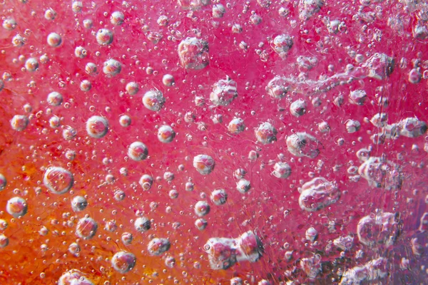 Abstract colorful texture of bubbles in ice — Stock Photo, Image