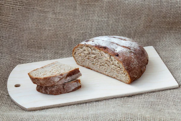 Sliced rye bread on a sacking background — Stock Photo, Image