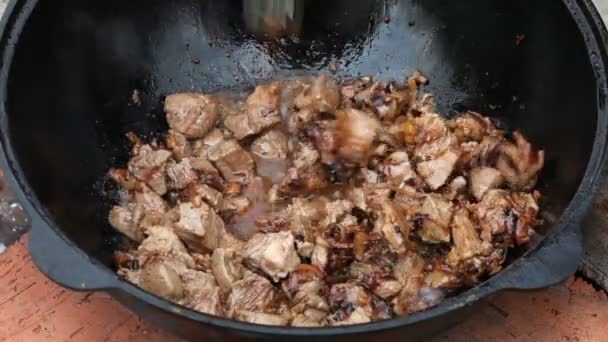 Pilaf, pilaw, plov, rice with meat in pan. Cooking process — Stock Video