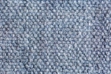 Ayrıntılı dokuma desenli ve yumuşak tekstil yüzeyli gri örülmüş kumaş dokusu.