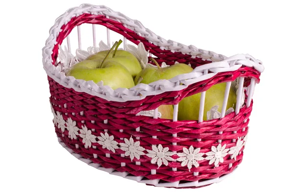 Handmade wicker red basket with green apples — Stock Photo, Image