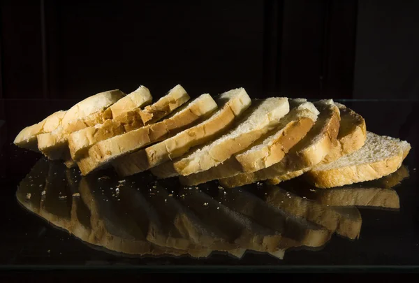 White bread on a dark background. — Stock Photo, Image