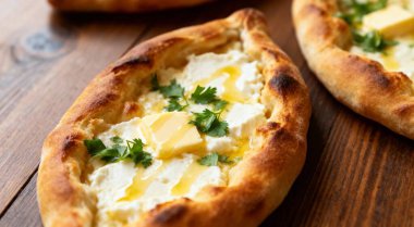 Fresh delicious Adjarian khachapuris on table  closeup
