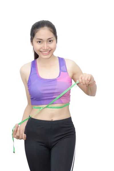 Woman in sport bra measuring her body with tape isolated on whit — Stock Photo, Image