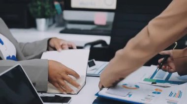 businesswoman using a calculator to calculate the numbers for financial document, finance accounting concept