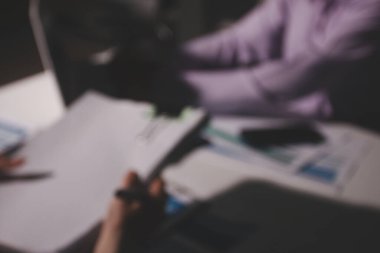 Above table with finance papers, graphs and big data during teamwork meeting with accounting or marketing team discussing budget, strategy or growth development. Closeup of SEO team doing research