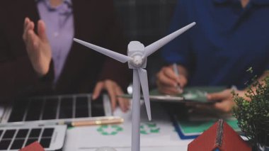 Close up of business people shaking hands over ESG strategic commitment workshop, SDGs report, global warming, green finance investment eco friendly and net zero waste in boardroom training building.
