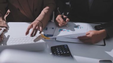 Auditor and accountant team working in office, analyze financial data and accounting record with calculator. Accounting company provide finance and taxation planning for profitable cash flow