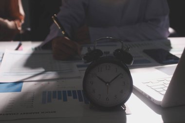 Above table with finance papers, graphs and big data during teamwork meeting with accounting or marketing team discussing budget, strategy or growth development. Closeup of SEO team doing research