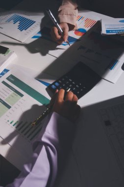 Above table with finance papers, graphs and big data during teamwork meeting with accounting or marketing team discussing budget, strategy or growth development. Closeup of SEO team doing research