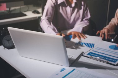 Above table with finance papers, graphs and big data during teamwork meeting with accounting or marketing team discussing budget, strategy or growth development. Closeup of SEO team doing research