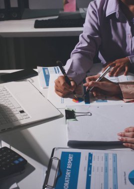 Above table with finance papers, graphs and big data during teamwork meeting with accounting or marketing team discussing budget, strategy or growth development. Closeup of SEO team doing research