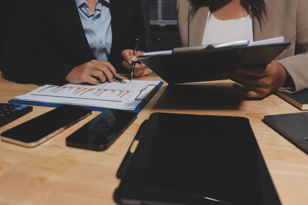 Accounting company provide finance and taxation planning for profitable cash flow, Auditor and accountant team working in office, analyze financial data and accounting record with calculator.Insight