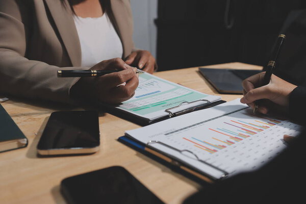 Accounting company provide finance and taxation planning for profitable cash flow, Auditor and accountant team working in office, analyze financial data and accounting record with calculator.Insight