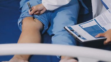close - up of doctor holding a knee in his hand