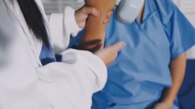 doctor holding stethoscope and giving patient hand to his hand.