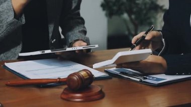 business team discussing documents with documents and pen at workplace in office