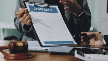 male hands holding contract and writing on document in office