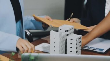 real estate agent showing a house to a new house.