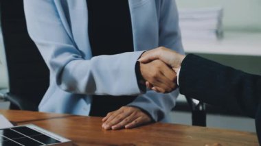 businesswoman handshake in office.