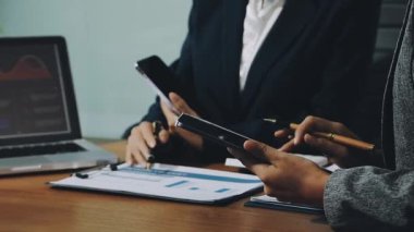 businessman using laptop to work with financial data on desk in office. finance and accounting concept.