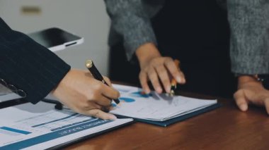 businessman analyzing financial charts on laptop in office.