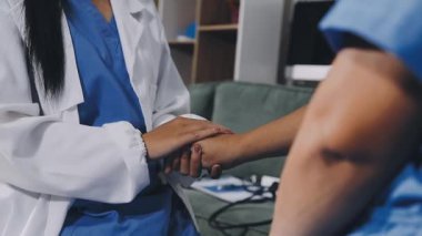 doctor in uniform and patient hands