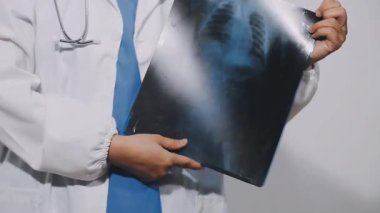 doctor holding a x - ray