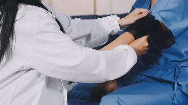 close - up of doctor hands giving injection of patient in hospital