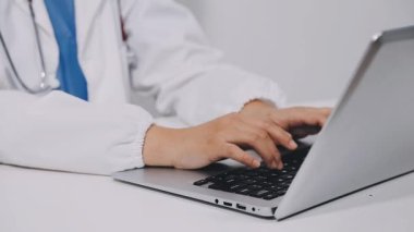 young man doctor working at office
