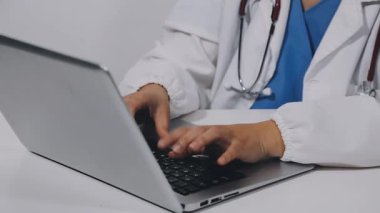 close up. doctor working on his desk.