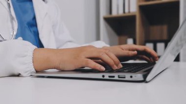 close up. doctor using laptop in the office.