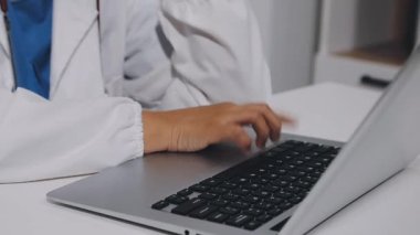 close up doctor hand with laptop computer