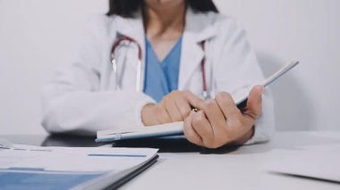 young female doctor holding a prescription