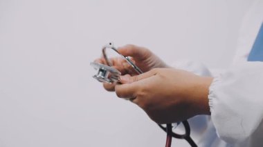 doctor holding stethoscope in hands, medical concept