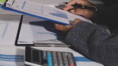 close up of businessman hands working at office.