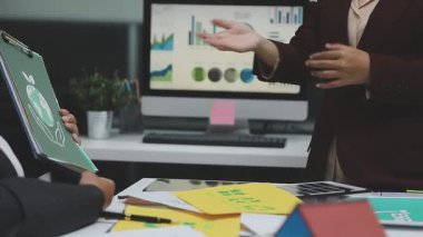 businesswoman shaking hands with business partner