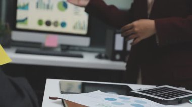 businessman shaking hands with colleague at office
