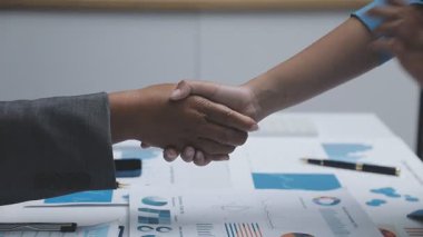 businessmen shaking hands in meeting room. business meeting concept.