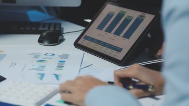 businessman analyzing financial data on computer