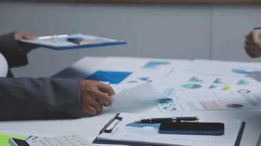close up of businesswoman analyzing data and graphs on computer