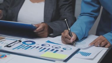 businessman analyzing data and analyze data in office.