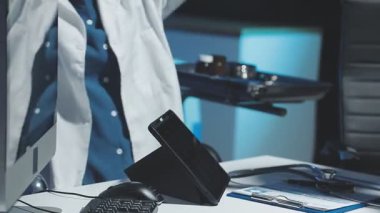 doctor using tablet in clinic.
