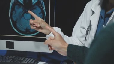 female doctor showing mri scan