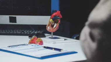 close up of a doctor with a heart in a modern office