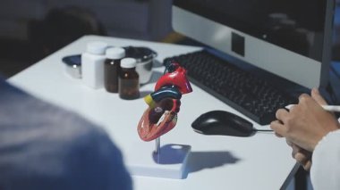 close up of young man working on digital tablet