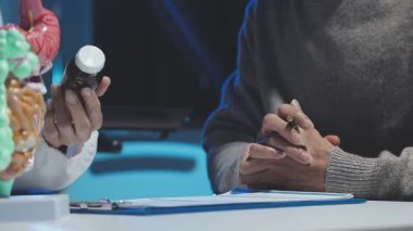 doctor examining x - ray of patient in clinic